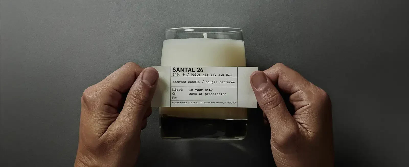 Santal candle on a styled surface, the dry woody alternative to Le Labo Santal 33, at Candle Delirium